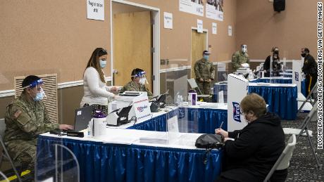 National Guard members assist with check-ins for vaccines in New Jersey.