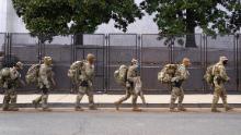 WASHINGTON, DC - JANUARY 16: National Guard troops march by security fencing near the U.S. Capitol on January 16, 2021 in Washington, DC. After last week&#39;s riots at the U.S. Capitol Building, the FBI has warned of additional threats in the nation&#39;s capital and in all 50 states. According to reports, as many as 25,000 National Guard soldiers will be guarding the city as preparations are made for the inauguration of Joe Biden as the 46th U.S. President. (Photo by Eric Thayer/Getty Images)