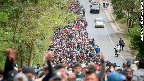 Honduran migrants walk along a road in Camotan, Guatemala, on Saturday, January 16.
