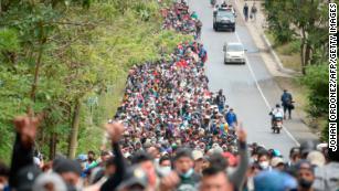 Honduran migrants walk along a road in Camotan, Guatemala, on Saturday, January 16.