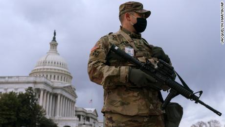 Tight security at mostly calm US capitols as Joe Biden is inaugurated