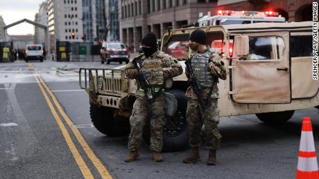Members of the National Guard keep watch on a street in Washington, DC on Sunday.