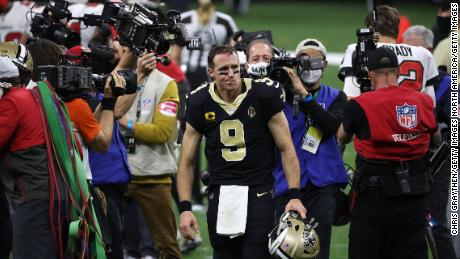 Brees leaves the field after his loss to Tampa Bay. 