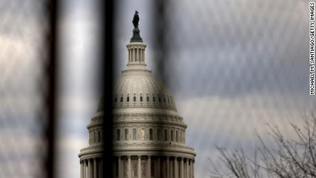 WASHINGTON, DC - JANUARY 17: The U.S. Capitol dome is seen beyond a security fence on January 17, 2021 in Washington, DC. After last week&#39;s riots at the U.S. Capitol Building, the FBI has warned of additional threats in the nation&#39;s capital and in all 50 states. According to reports, as many as 25,000 National Guard soldiers will be guarding the city as preparations are made for the inauguration of Joe Biden as the 46th U.S. President.  (Photo by Michael M. Santiago/Getty Images)