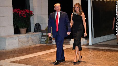 US President Donald Trump and First Lady Melania Trump arrive for a Christmas Eve dinner with his family at Mar-A-Lago in Palm Beach, Florida.