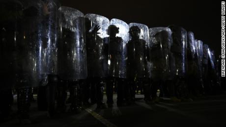 Riot police prepare to move demonstrators away from the US Capitol in Washington, DC, on January 6, 2021.
