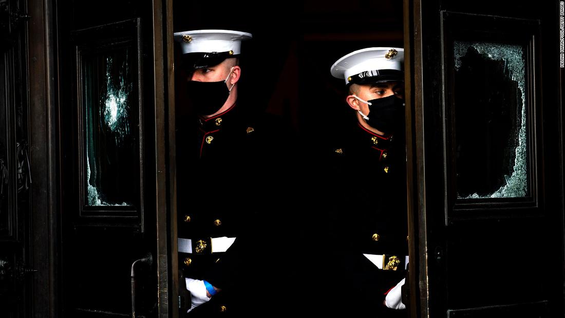 US Marines are posted on the East Front steps of the Capitol.