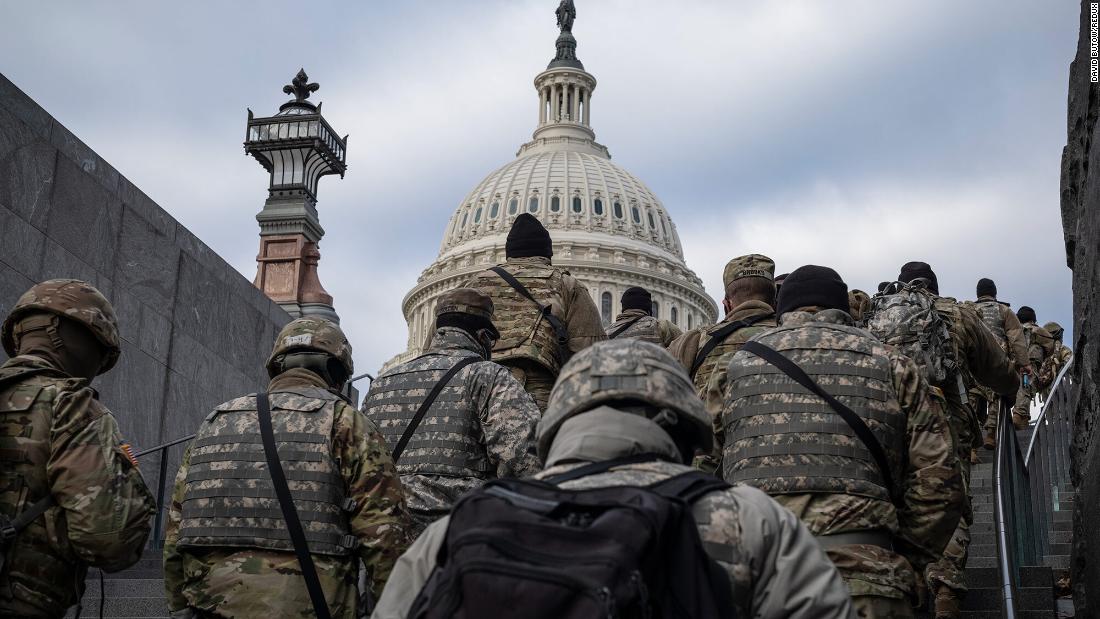 National Guard members walk on the US Capitol grounds on the day before the inauguration. The Pentagon &lt;a href=&quot;https://www.cnn.com/2021/01/15/politics/pentagon-national-guard-inauguration/index.html&quot; target=&quot;_blank&quot;&gt;authorized up to 25,000 National Guard members&lt;/a&gt; to help secure the event.