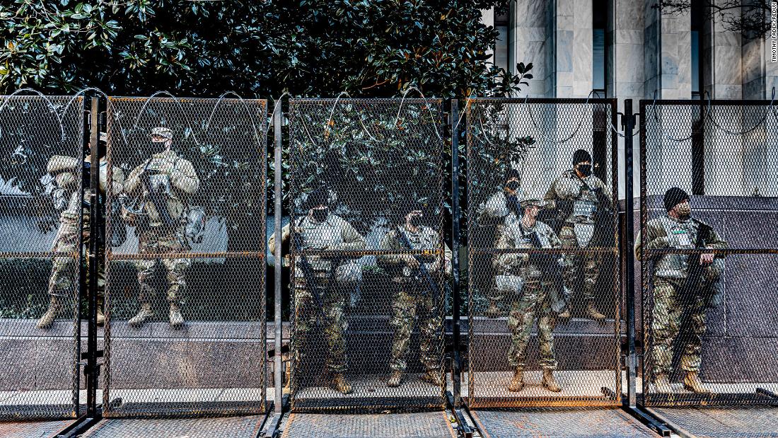 Members of the National Guard are positioned within a security perimeter that includes the Capitol, the White House and the National Mall.