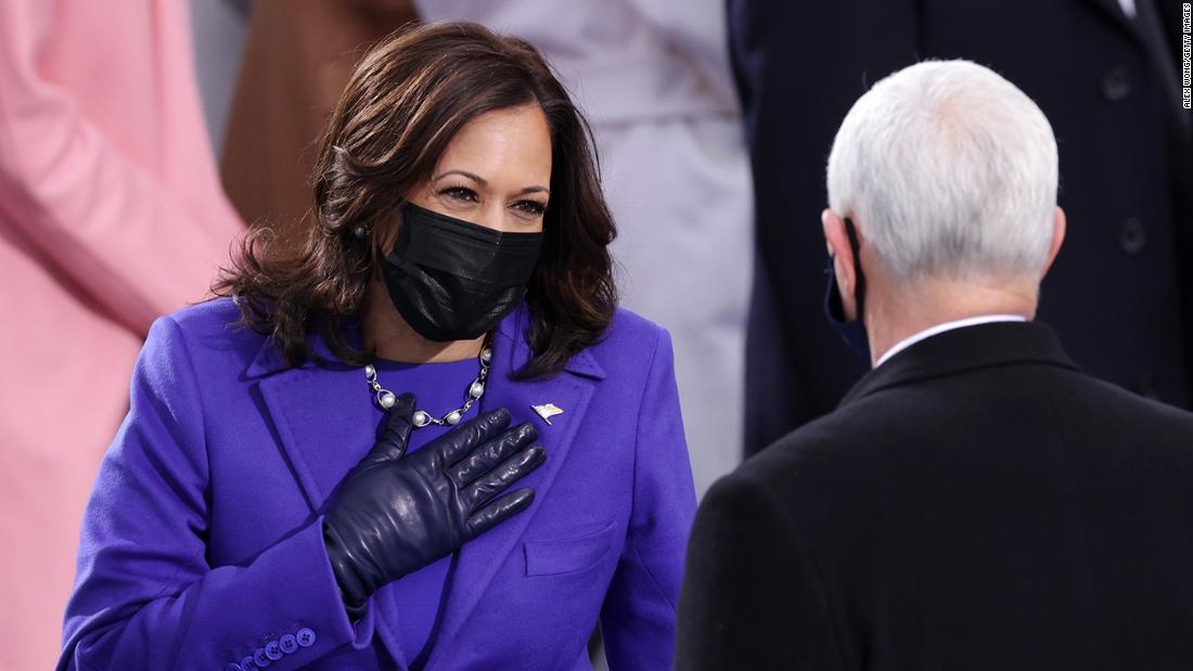 Kamala is greeted in Tanzania by welcome party wearing T-shirts with her  FACE