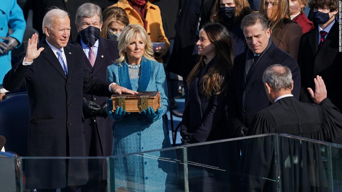 Biden is sworn in as president by Chief Justice John Roberts as his wife holds the Bible. Biden&#39;s children Ashley and Hunter are on the right. &quot;Today, on this January day, my whole soul is in this: bringing America together, uniting our people, uniting our nation,&quot; Biden said in his inaugural address.