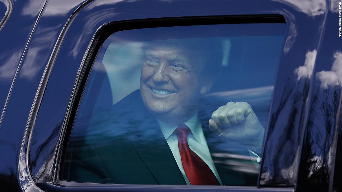 President Donald Trump acknowledges his supporters after landing in West Palm Beach, Florida. He skipped the inauguration.