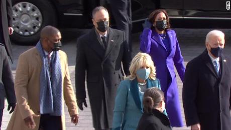 Eugene Goodman, the Capitol Police officer who led rioters away from the Senate during the January 6 insurrection, escorts Kamala Harris to the inauguration ceremony.