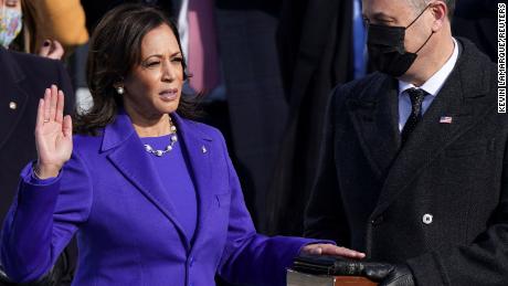 Kamala Harris is sworn in as vice president as her husband, Doug Emhoff, holds the Bible.