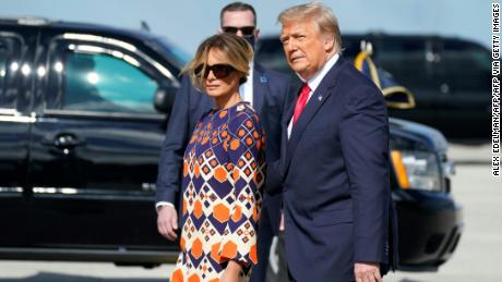 Outgoing US President Donald Trump and First Lady Melania arrive at Palm Beach International Airport in West Palm Beach, Florida, on January 20, 2021. - President Trump and the First Lady travel to their Mar-a-Lago golf club residence in Palm Beach, Florida, and will not attend the inauguration for President-elect Joe Biden. (Photo by ALEX EDELMAN / AFP) (Photo by ALEX EDELMAN/AFP via Getty Images)
