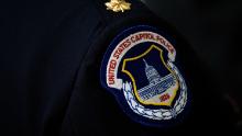 WASHINGTON, DC - MAY 9: A view of a U.S. Capitol Police badge on a uniform as officers wait for the start of an annual memorial service in honor of the four U.S. Capitol Police officers who have died in the line of duty, at the U.S. Capitol, May 9, 2016, in Washington, DC. Sgt. Clinton Holtz (2014), Detective John Gibson (1998), Officer Jacob Chestnut (1998) and Sgt. Christopher Eney (1984) are the four members of the U.S. Capitol Police who have lost their lives while on duty. (Photo by Drew Angerer/Getty Images)