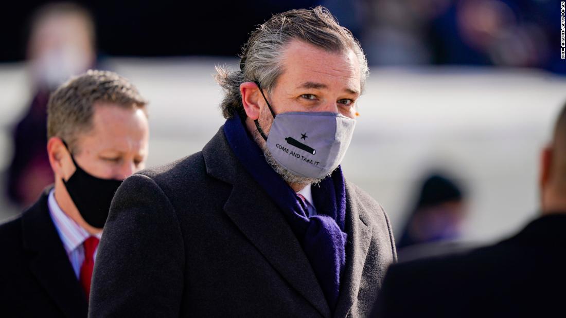 US Sen. Ted Cruz, a Republican from Texas, wears a face mask that reads &quot;Come and Take It&quot; as he arrives at the inauguration.