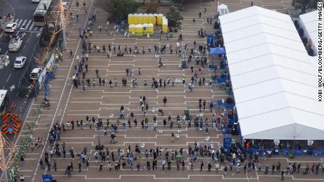People line up outside a Covid-19 mass vaccination center in Rabin Square in this aerial photograph taken in Tel Aviv on January 4, 2020.