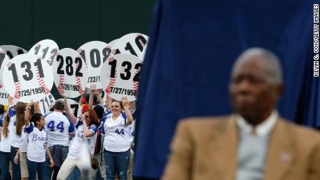 Fans hold up signs in the outfield with every home run hit by Aaron as he is honored on the 40th anniversary of his 715th on April 8, 2014, at Turner Field in Atlanta, Georgia. 