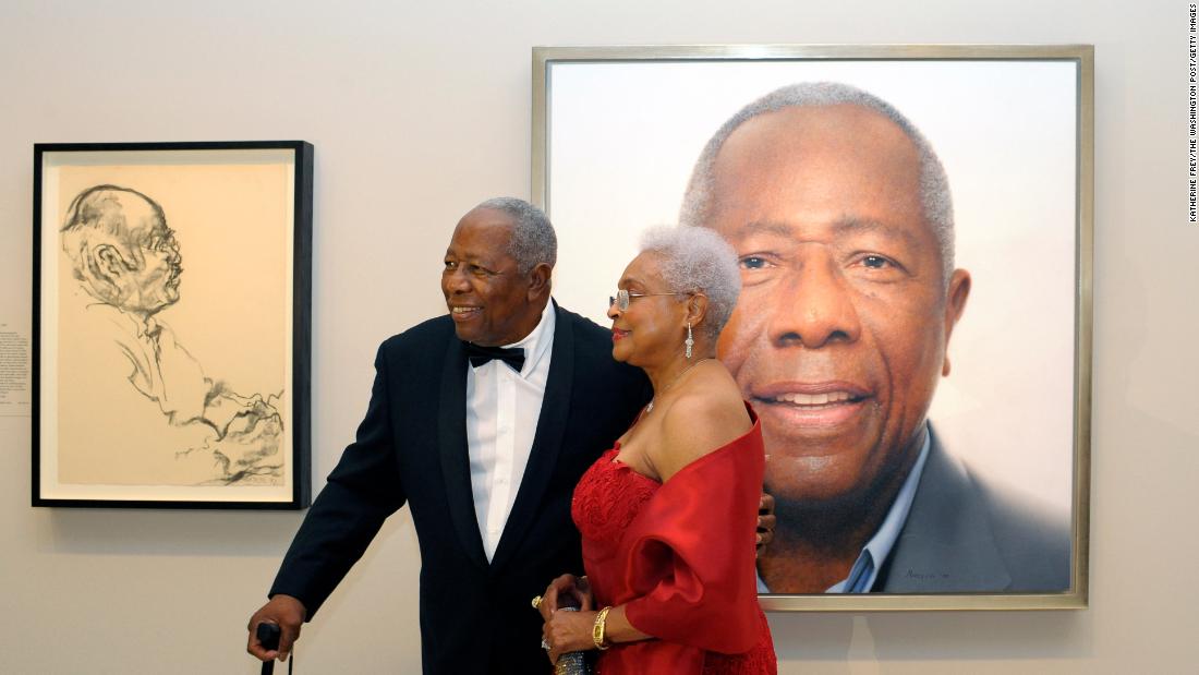 Aaron and his wife, Billye, pose in front of his portrait at the National Portrait Gallery in Washington, DC, in 2015.