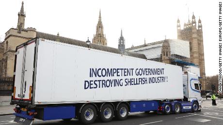 A truck drives past the Houses of Parliament in a protest against post-Brexit red tape.