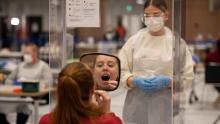 A student takes a swab for a Covid-19 test at the University of Hull in northern England on November 30, 2020.