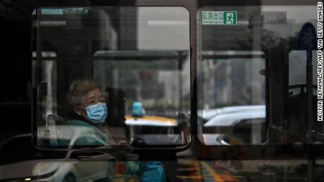 Face masks are one of the few remaining signs that point to Wuhan's past as the epicenter of a deadly pandemic.