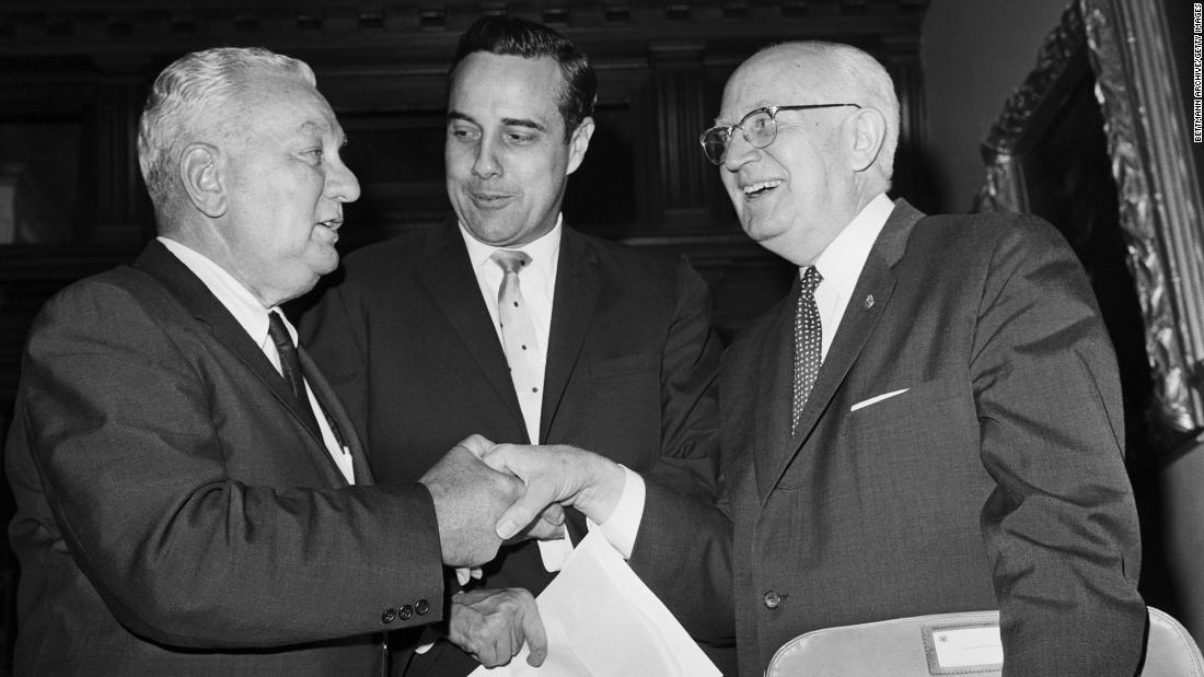 Dole is seen between fellow US Reps. Charles A. Halleck and Charles B. Hoeven in 1962. After the war, Dole went into politics. He served in the Kansas House of Representatives before becoming Russell County prosecutor in 1953. In 1960, Dole was elected to the US House of Representatives.