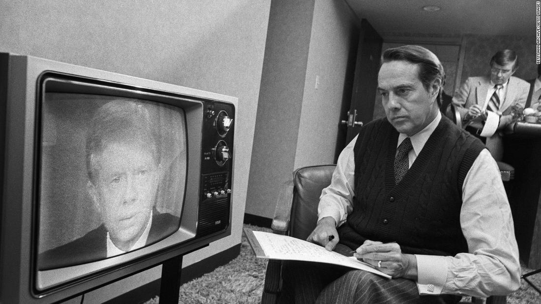 Dole takes notes as he watches President Jimmy Carter speak in 1980. Dole was making his first run for president.