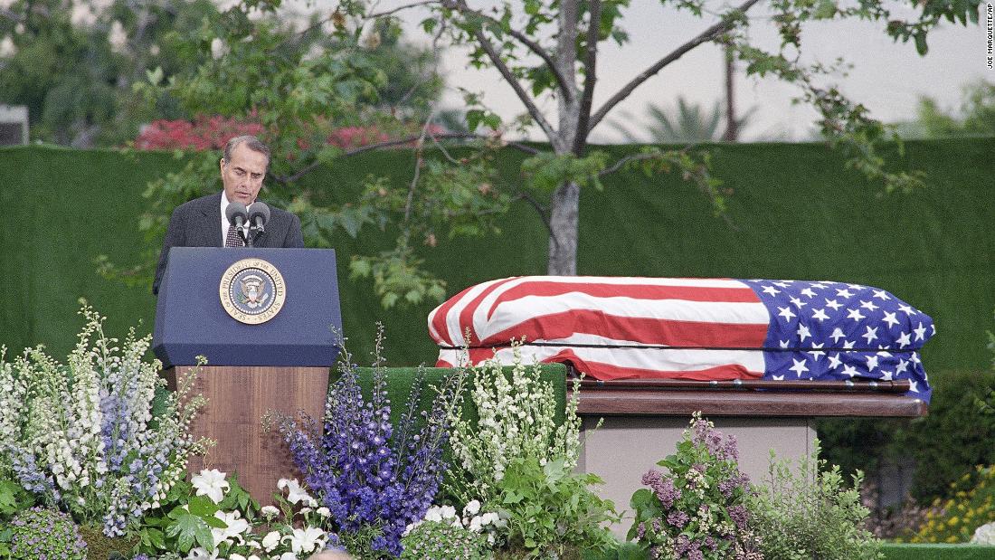 Dole delivers a eulogy at the funeral of former President Richard Nixon in 1994.