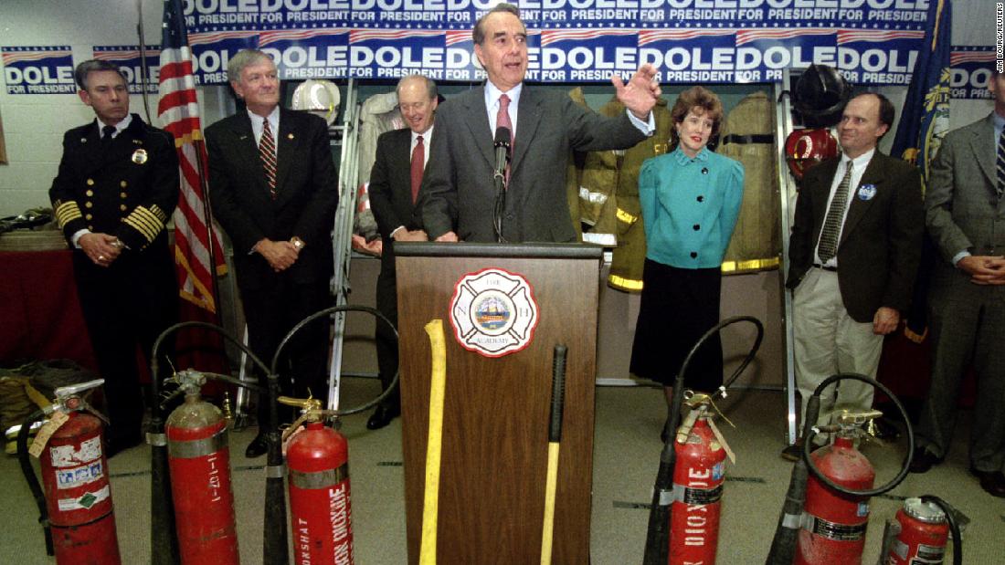 Dole, running for president once again, speaks to a crowd of firefighters and their families while on the campaign trail in 1996.