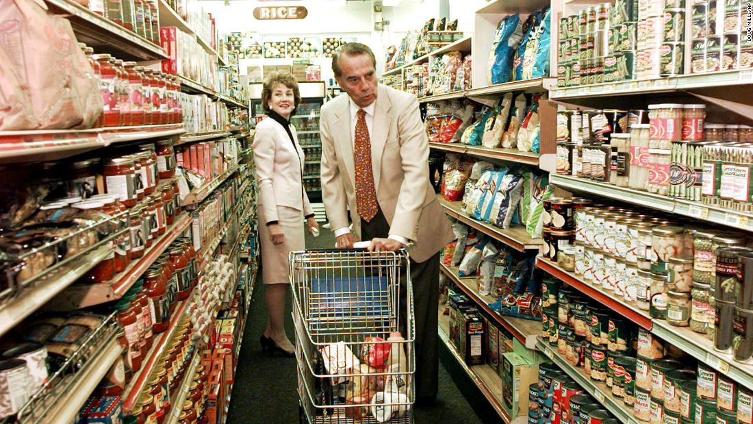 Dole and his wife, Elizabeth, shop at a Florida food market in 1996.