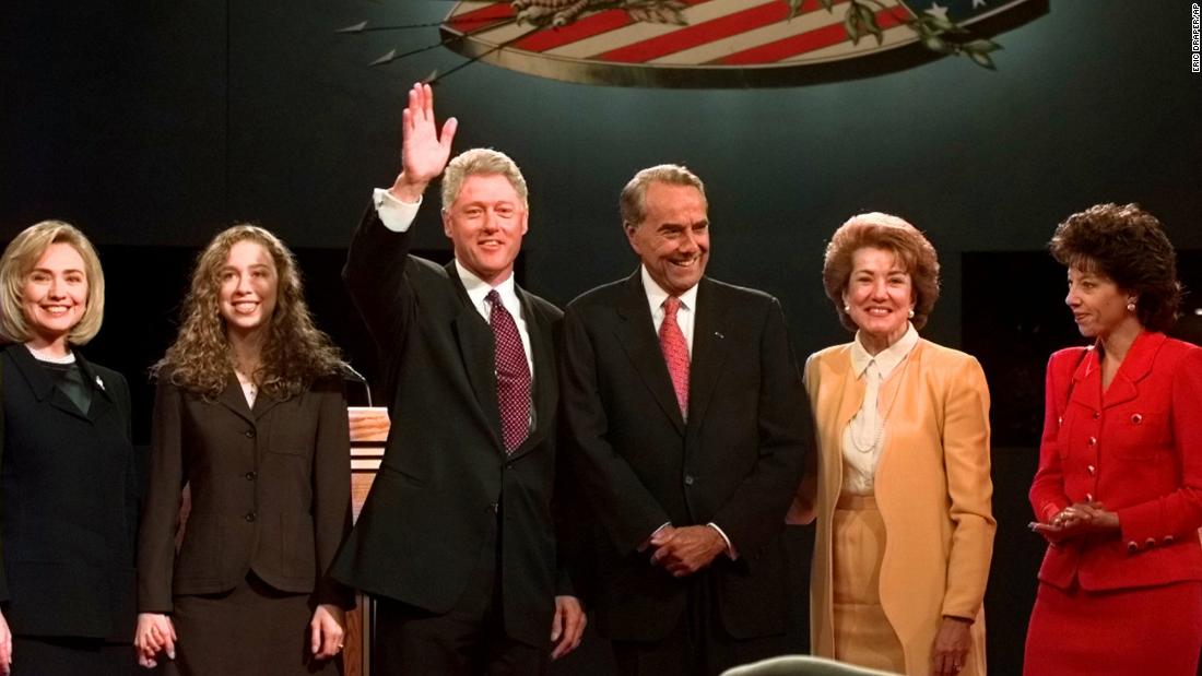 Dole, his wife and his daughter pose with President Bill Clinton and his family after their first presidential debate in 1996.