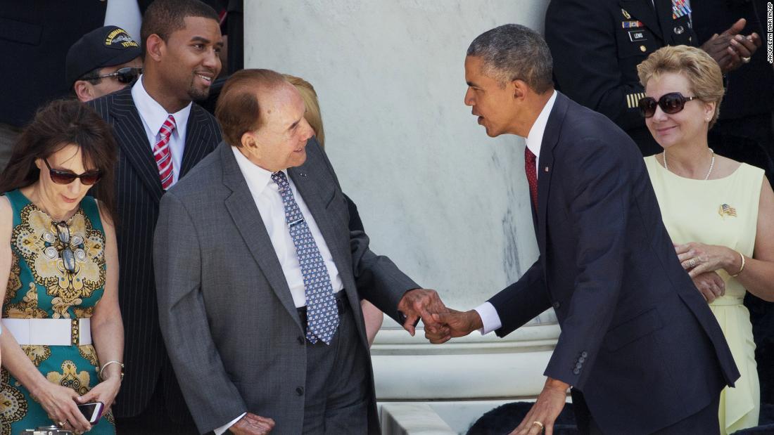 President Barack Obama greets Dole after a Memorial Day ceremony at Arlington National Cemetery in 2015.