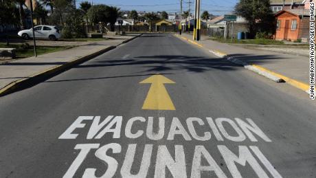 A warning sign painted on the street reading &quot;Tsunami Evacuation&quot; in La Serena, Coquimbo, Chile, taken on June 11, 2015.
