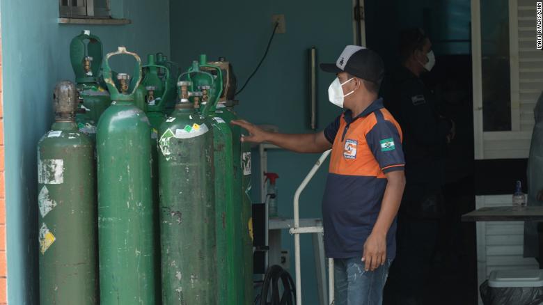 Man with oxygen tanks in Iranduba.