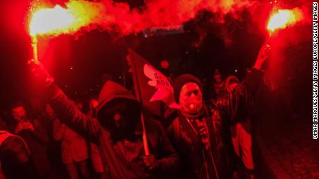 WARSAW, POLAND - JANUARY 27: Pro-choice protesters light flares during a protest on January 27, 2021 in Warsaw, Poland. A Constitutional Court ruling in October determined that abortions are only legal in cases of rape and incest, and when the mother&#39;s life is in danger, but the decision had not yet been officially published until now, three months after the ruling sparked widespread protests. (Photo by Omar Marques/Getty Images)