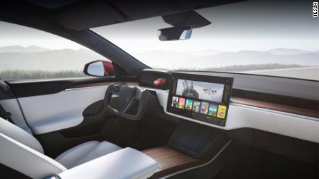 An artist rendering of the interior of the new Model S with its distinctive steering wheel.