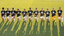 North Carolina Courage players kneel during the national anthem during a game against the Washington Spirit.