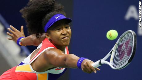 Osaka returns the ball during her women&#39;s singles semifinal match against Jennifer Brady in the 2020 US Open.