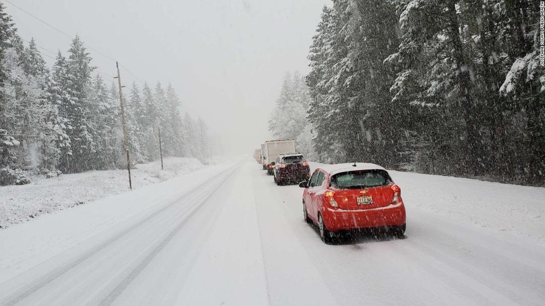 Health workers trapped in snow administer coronavirus vaccine to trapped drivers