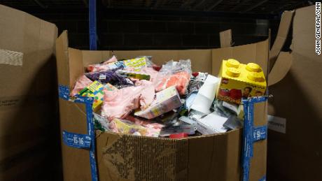 One of many large boxes of returned products that fill the warehouse. The returned products in this box will eventually be sorted and categorized.