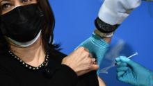 TOPSHOT - US Vice President Kamala Harris receives her second dose of the Moderna Covid-19 vaccine from National Institutes of Health (NIH) Nurse Practitioner Judy Lai Yee Chan, at the NIH in Bethesda, Maryland, on January 26, 2021. (Photo by Brendan Smialowski / AFP) (Photo by BRENDAN SMIALOWSKI/AFP via Getty Images)