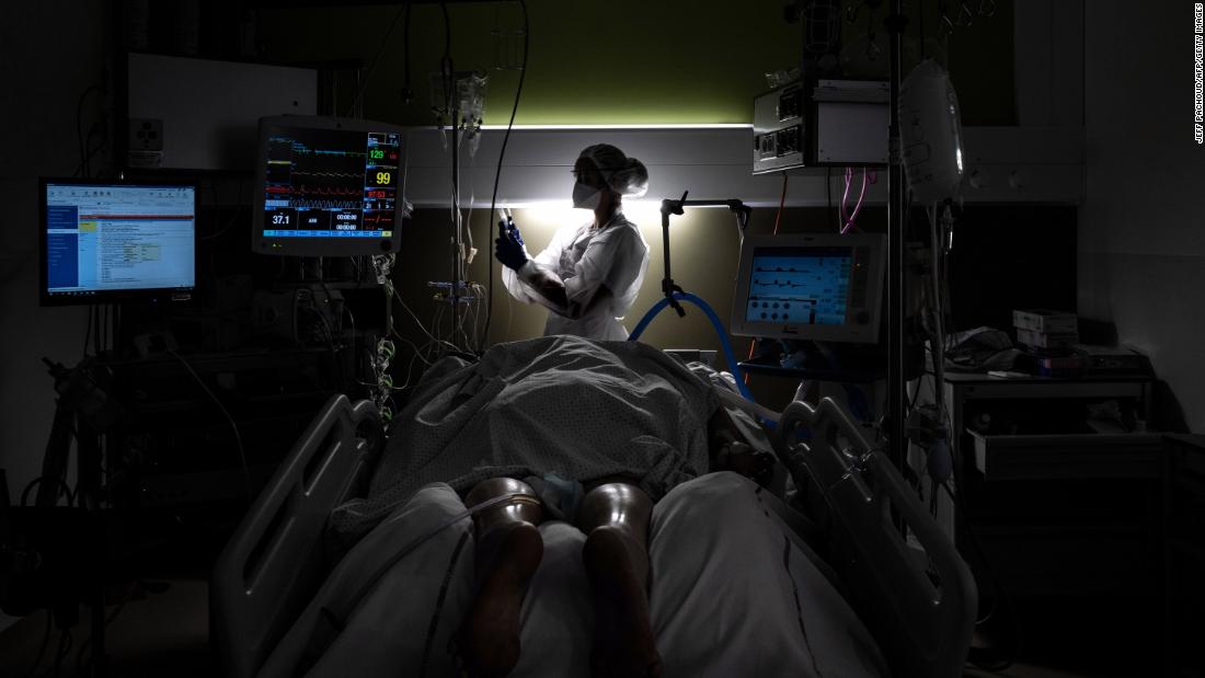 A nurse takes care of a Covid-19 patient at a hospital in Pierre-Benite, France, on January 25. 