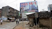 A one-child policy billboard saying, &quot;Have less children, have a better life&quot; greets residents on the main street of Shuangwang in southern China in 2007. 