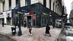 People walk past a GameStop store in Midtown Manhattan on January 27, 2021 in New York City. Stock shares of videogame retailer GameStop Corp has increased 700% in the past two weeks due to amateur investors. (Photo by Michael M. Santiago/Getty Images)