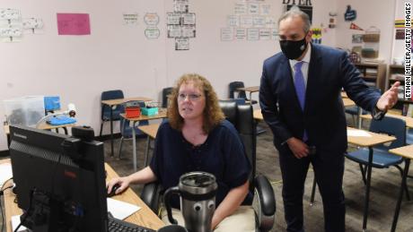 Clark County School District Superintendent Jesus Jara, here checking on a teacher running an online algebra class, says there is just no substitute for in-person interaction.