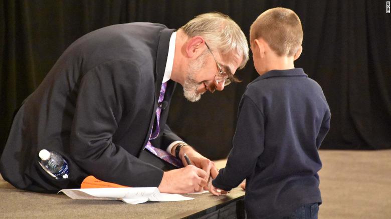 Kastner is shown in 2016 at the inaugural DADA2 conference in Bethesda, Maryland, with a boy who has DADA2, an autoinflammatory disorder. The award-winning scientist identified the genetic mutation that causes the disease and also helped develop treatments.