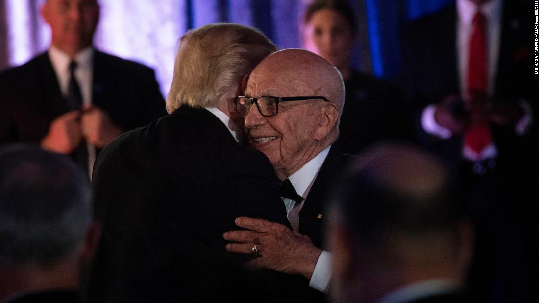Murdoch embraces US President Donald Trump at an event in New York in 2017.