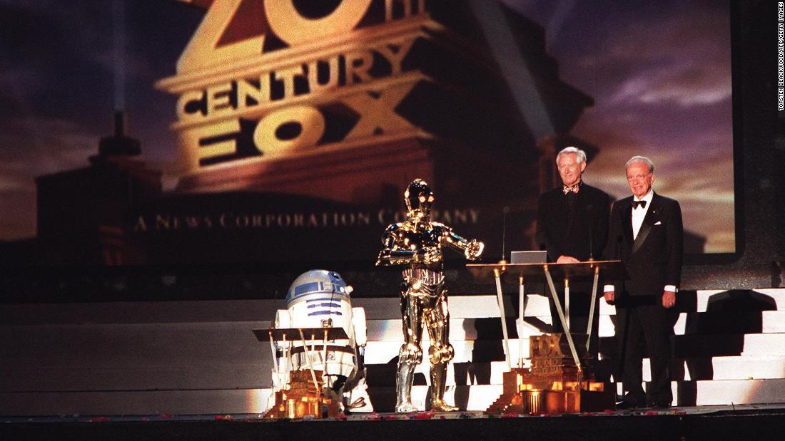 Murdoch, right, and Stuart Horney are joined by &quot;Star Wars&quot; characters R2D2 and C3PO as they officially open Fox Studios Australia in 1999.